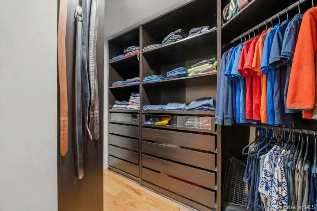 A second primary suite closet with the same custom system. A second primary suite closet with the same custom system.