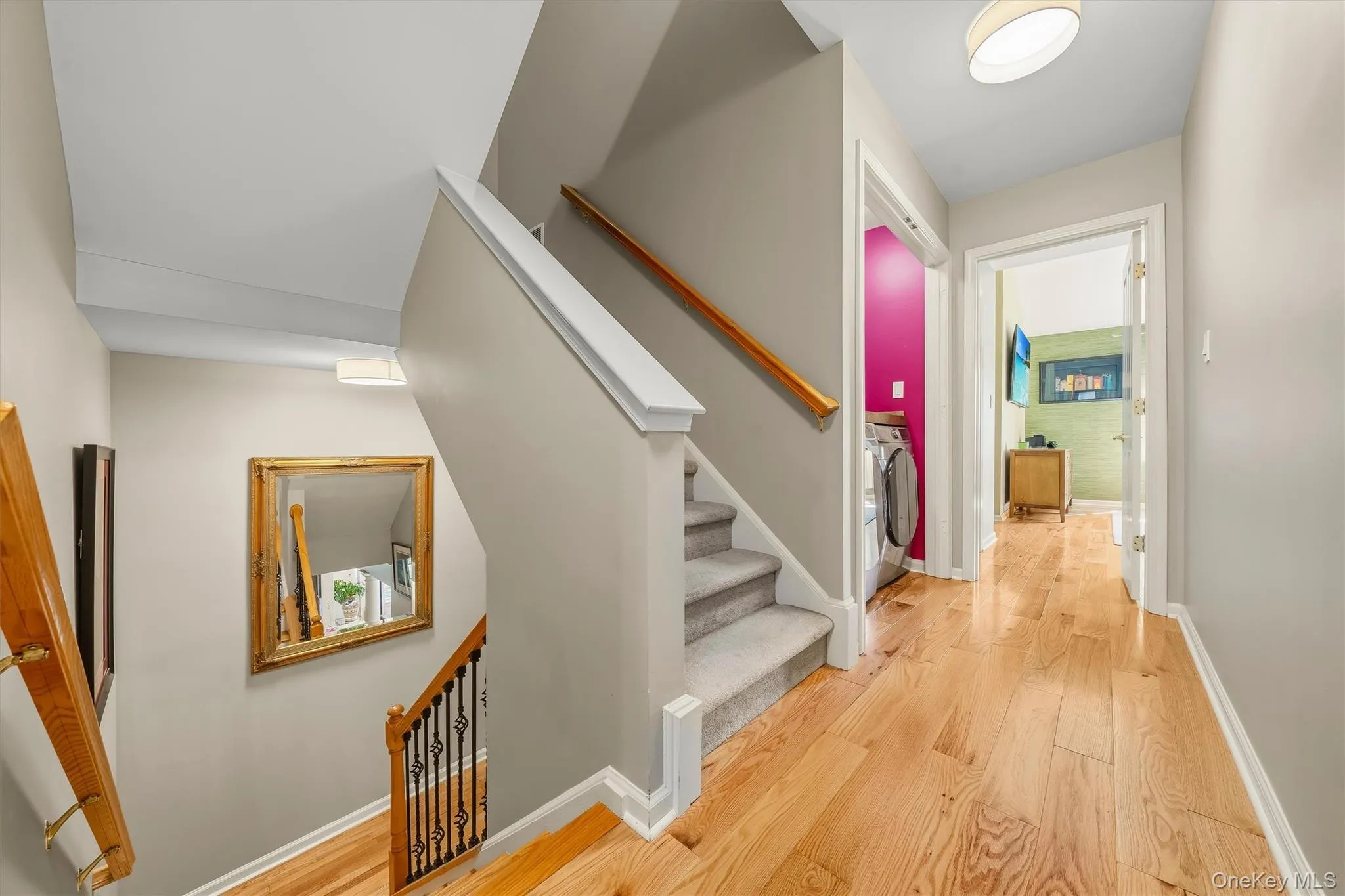 Upstairs to the second floor is where the bedrooms are. Notice the new black wrought iron spindles. Upstairs to the second floor is where the bedrooms are. Notice the new black wrought iron spindles.