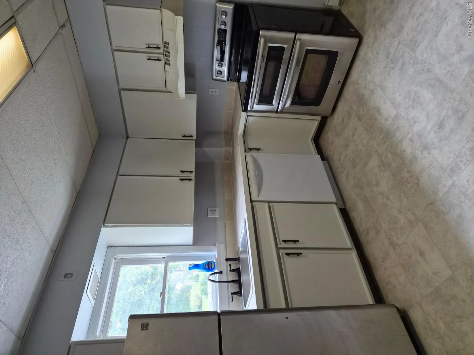 Kitchen with Dishwasher, electric range and refrigerator Kitchen with Dishwasher, electric range and refrigerator