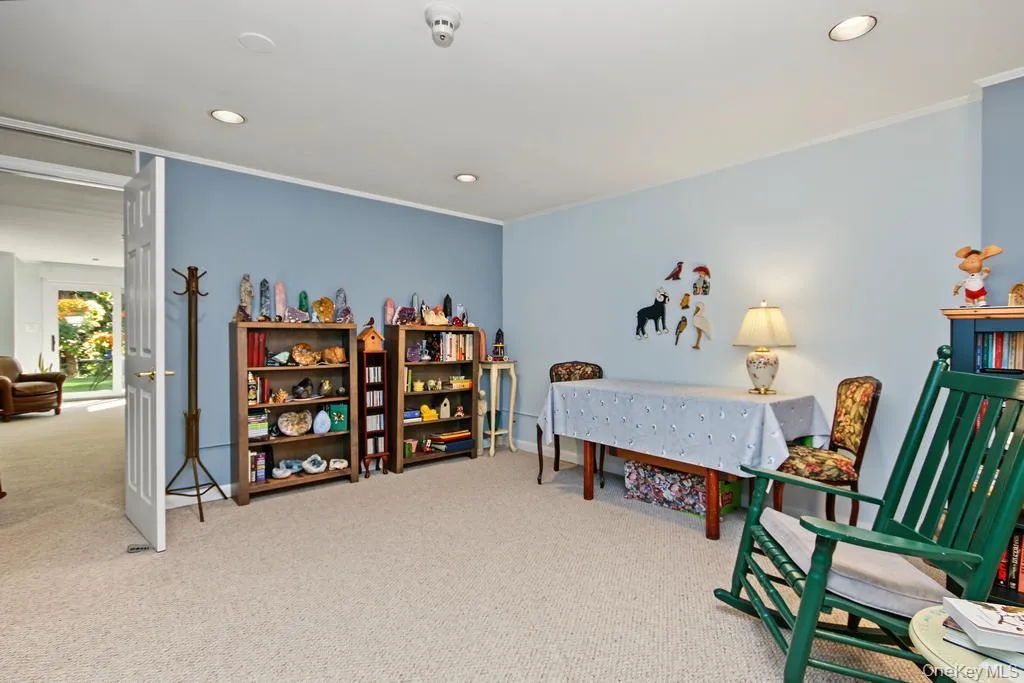 Library on lower level has wall to wall carpet Library on lower level has wall to wall carpet