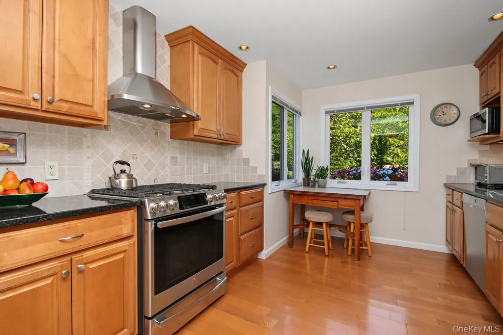 Updated Kitchen featuring hardwood floors Updated Kitchen featuring hardwood floors