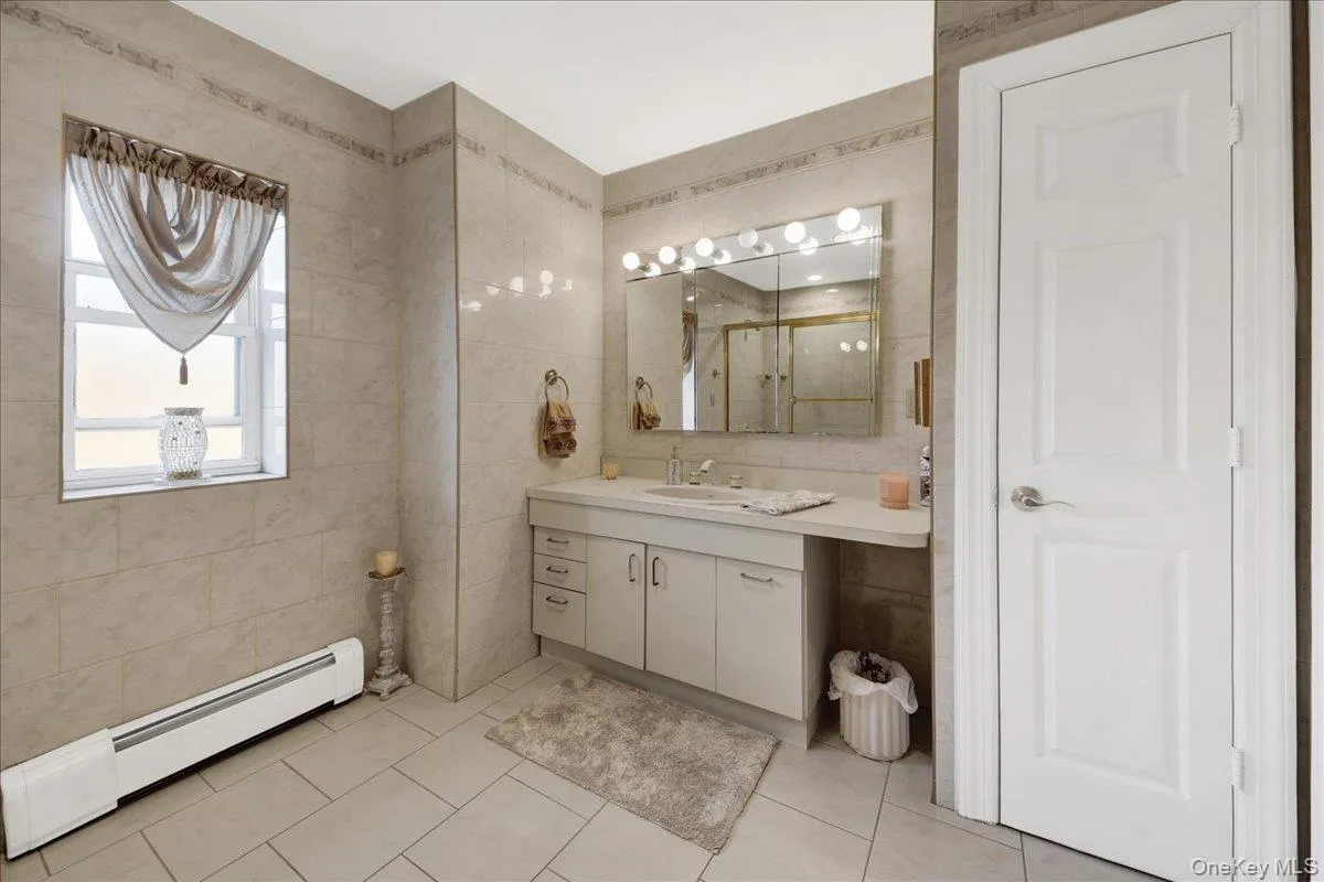 Grand spa full bath with linen closet on second floor Grand spa full bath with linen closet on second floor