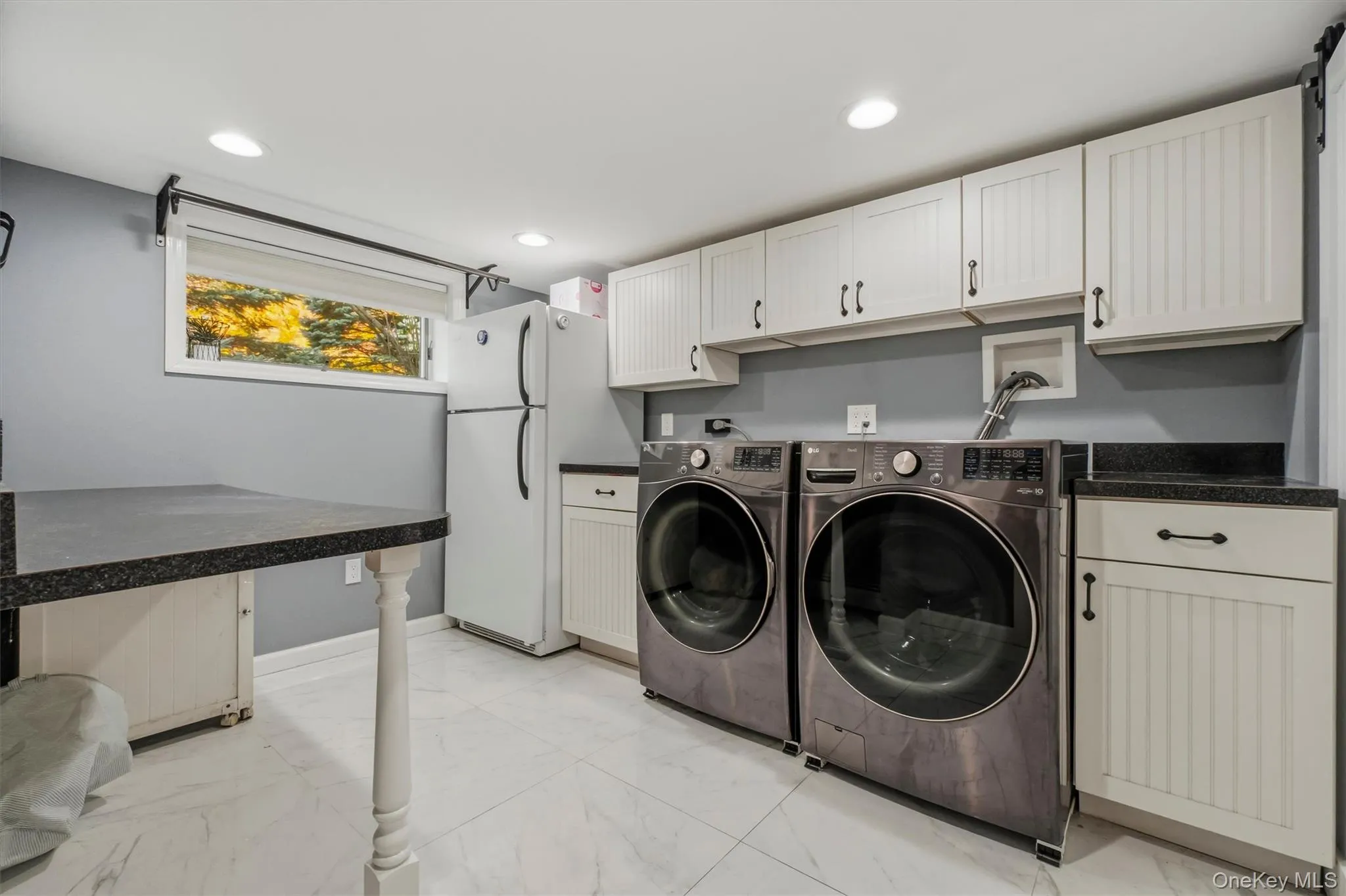 Great cabinet & counter space in updated laundryroom. Great cabinet & counter space in updated laundryroom.