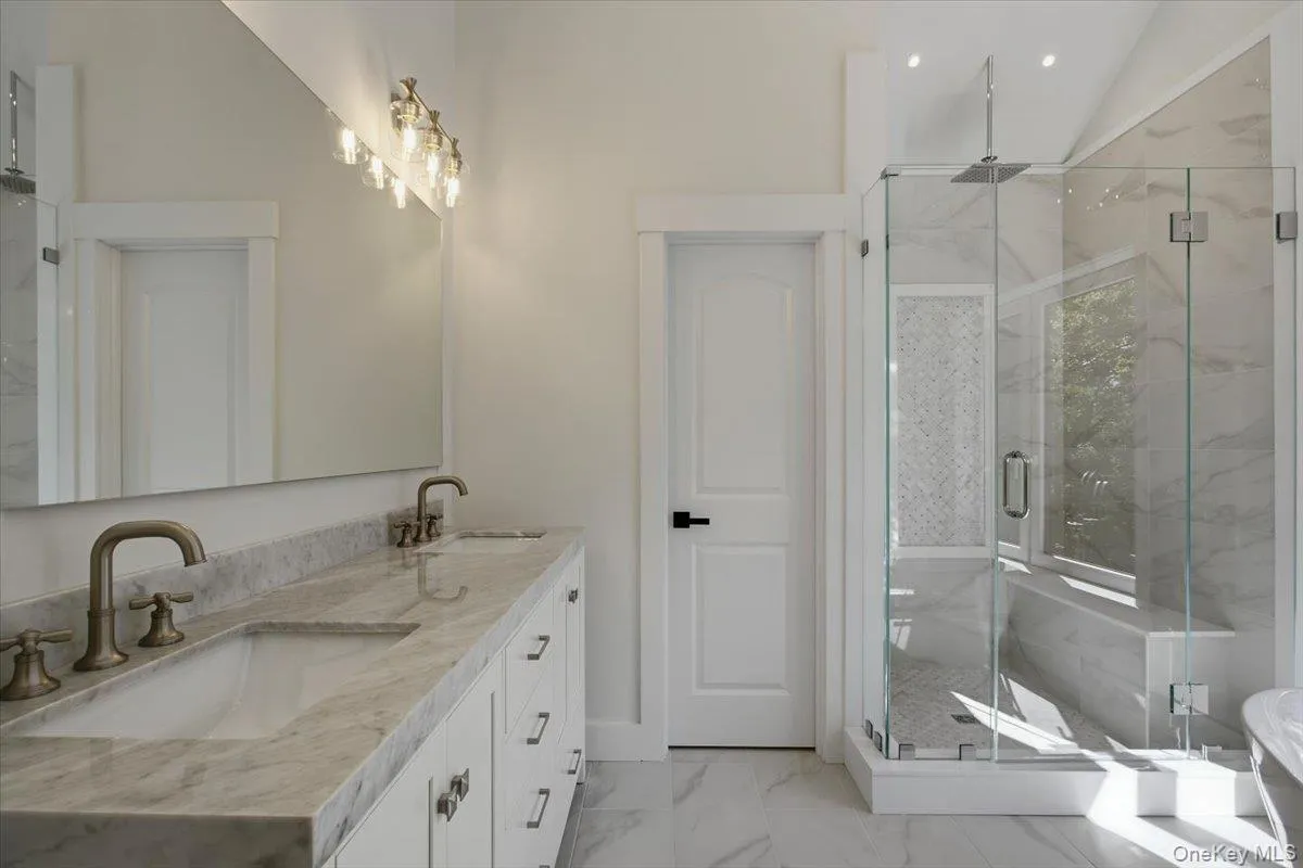 Primary bathroom, walk in shower with sitting bench, rain head and body sprays, separate toilet room Primary bathroom, walk in shower with sitting bench, rain head and body sprays, separate toilet room