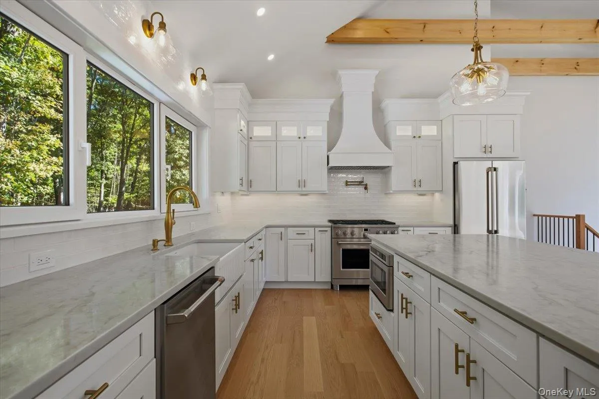 Additional View of Kitchen, cabinetry hood, oversized window with gooseneck lighting Additional View of Kitchen, cabinetry hood, oversized window with gooseneck lighting