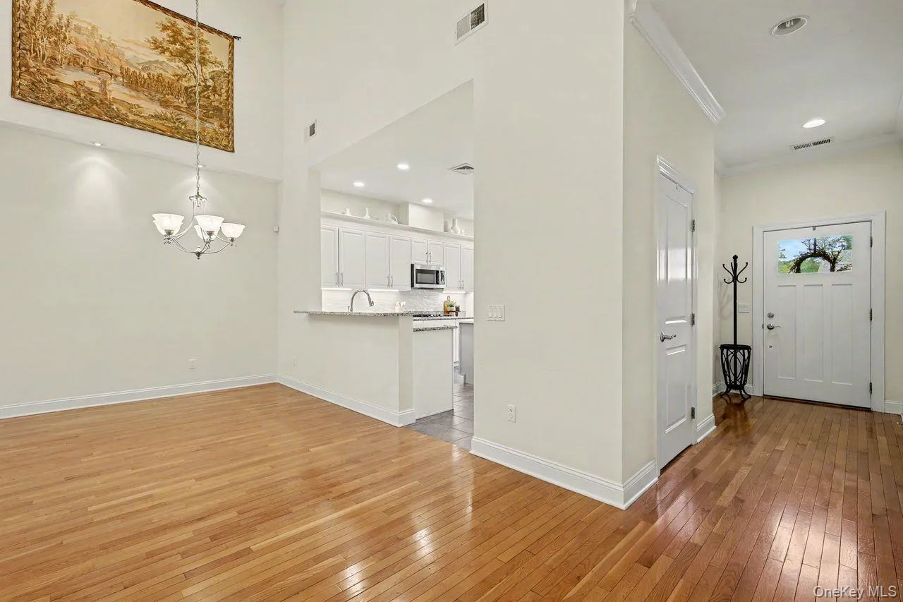 Entrance foyer with coat closet and access to two car garage. Entrance foyer with coat closet and access to two car garage.