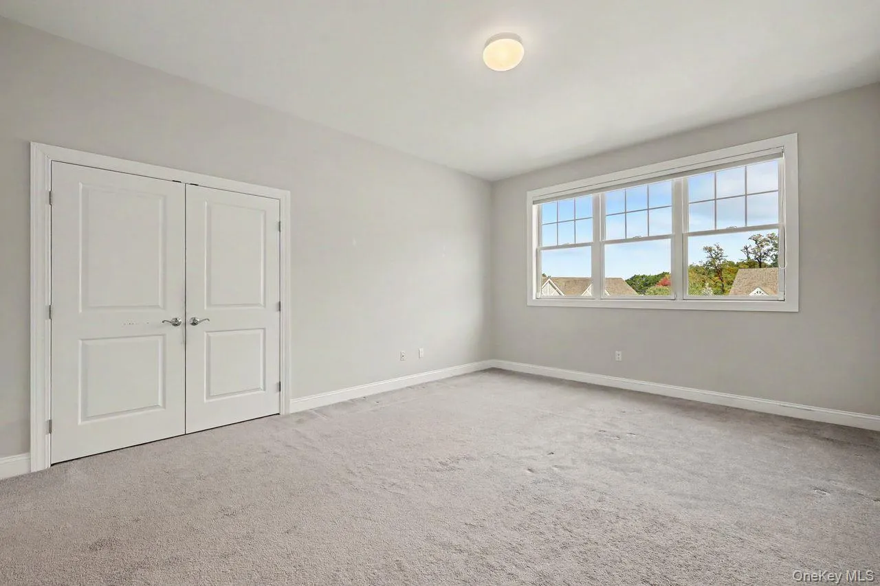 Second floor bedroom with large closet space. Second floor bedroom with large closet space.