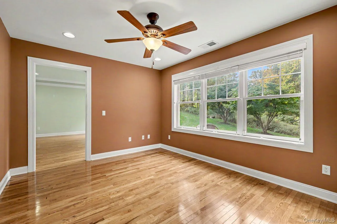 Forts floor den between primary suite and living space with ceiling fan and hi-hats. Forts floor den between primary suite and living space with ceiling fan and hi-hats.