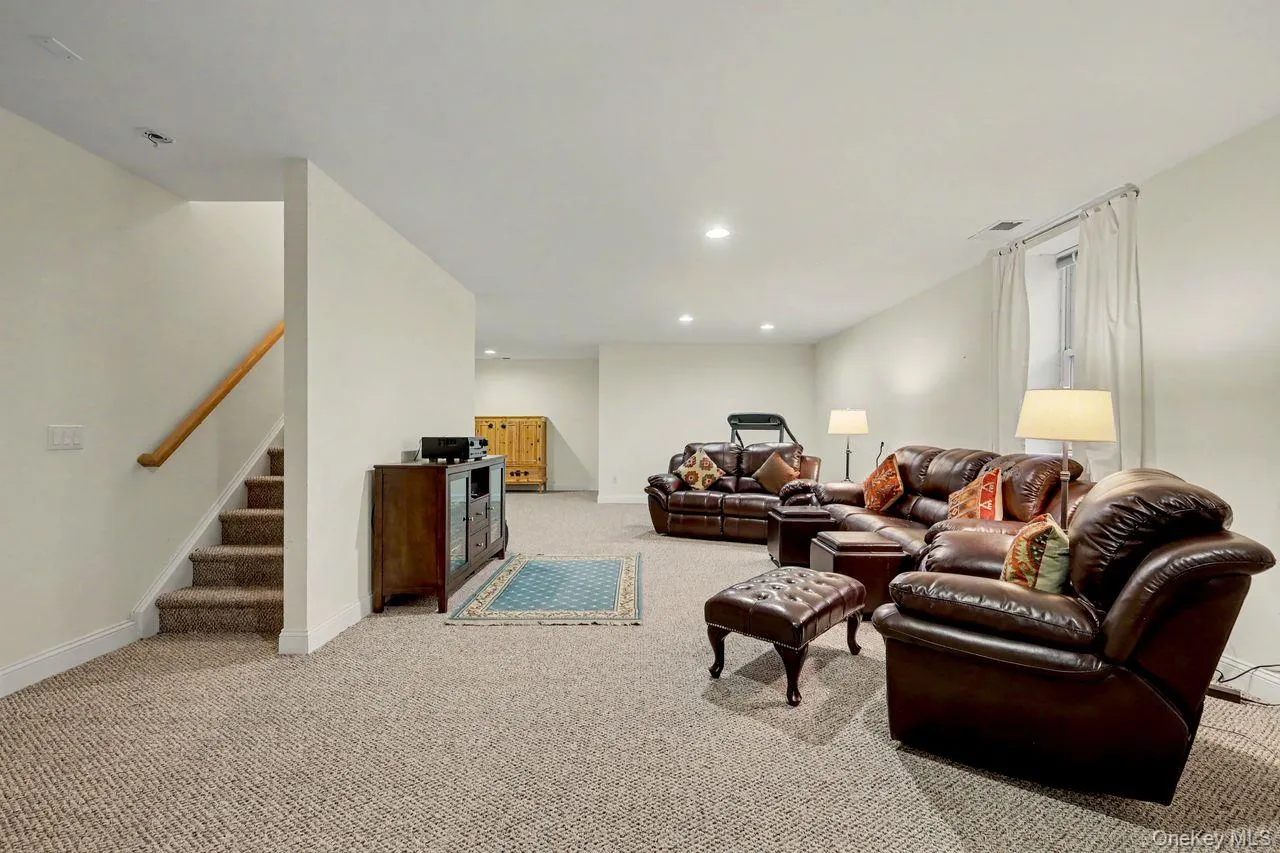 Finished basment with living room set up. Finished basment with living room set up.