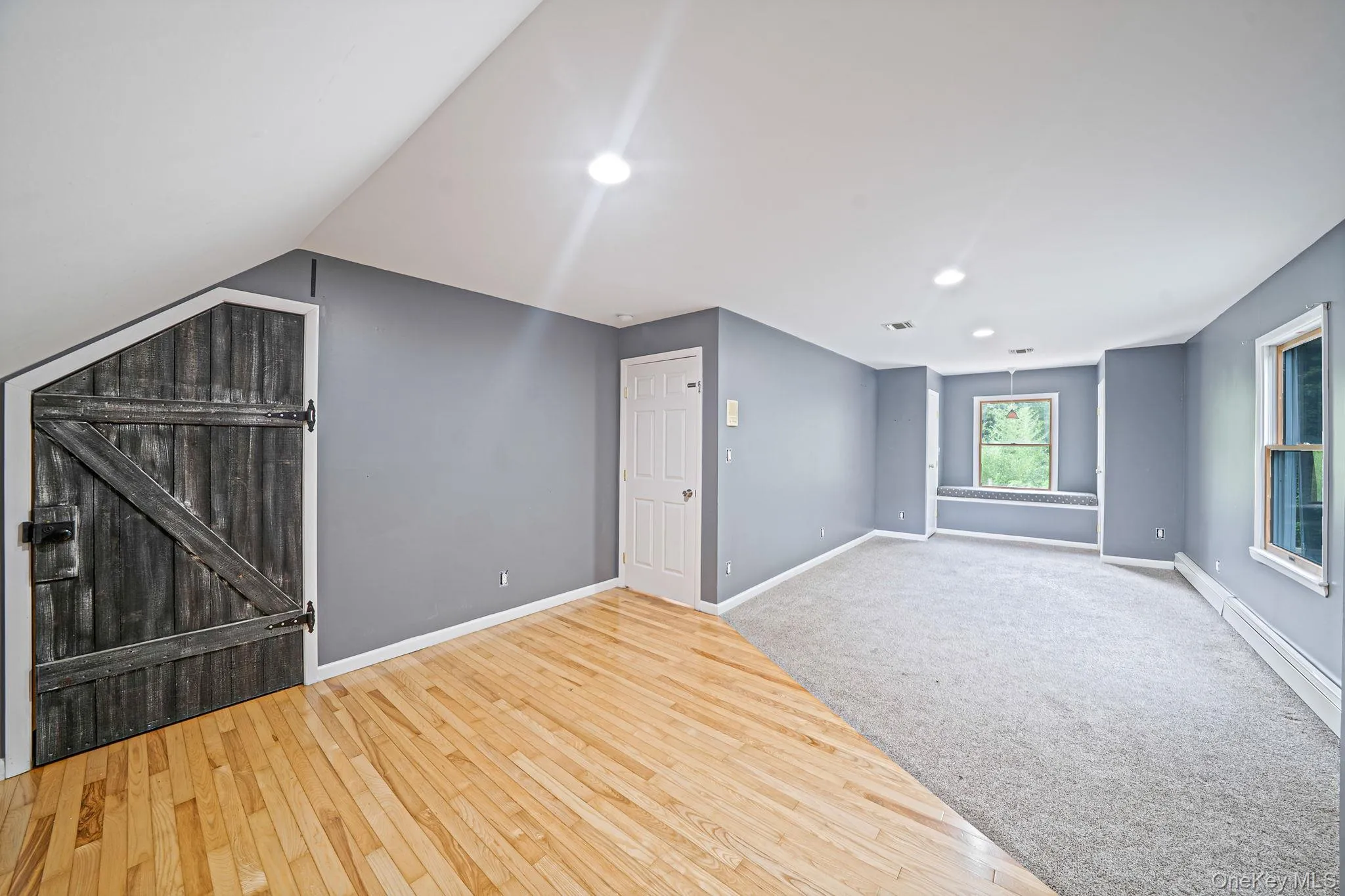 Bedroom 3 second floor -Extra Large Bedroom with window bench, carpet and wood floor, and 2 closets Bedroom 3 second floor -Extra Large Bedroom with window bench, carpet and wood floor, and 2 closets