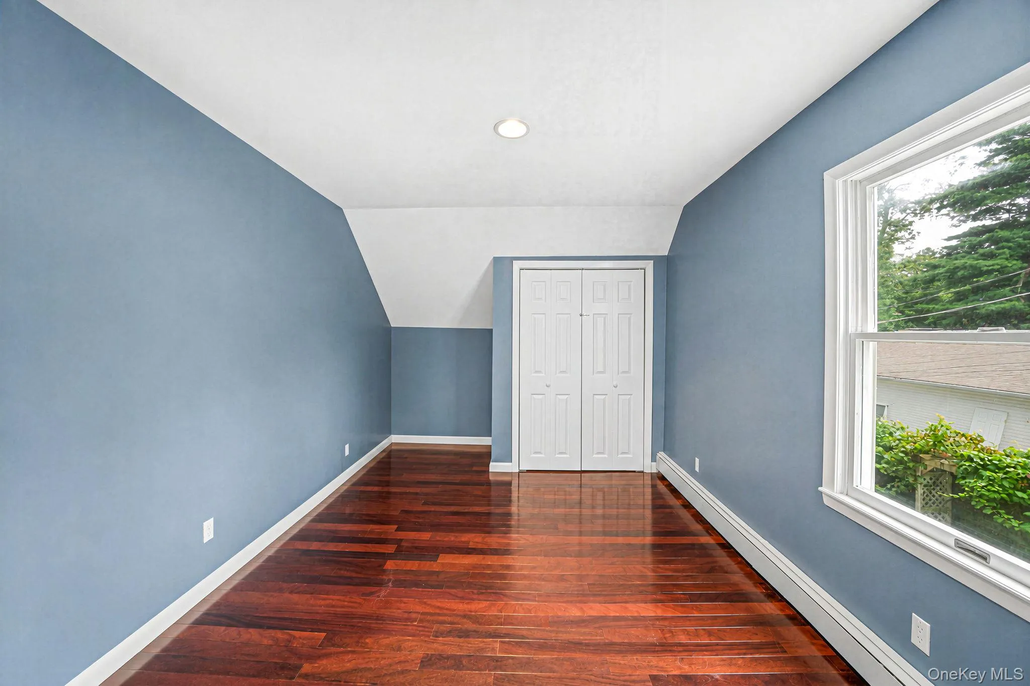 Bedroom 2 second floor -roomy bedroom with wood floor Bedroom 2 second floor -roomy bedroom with wood floor