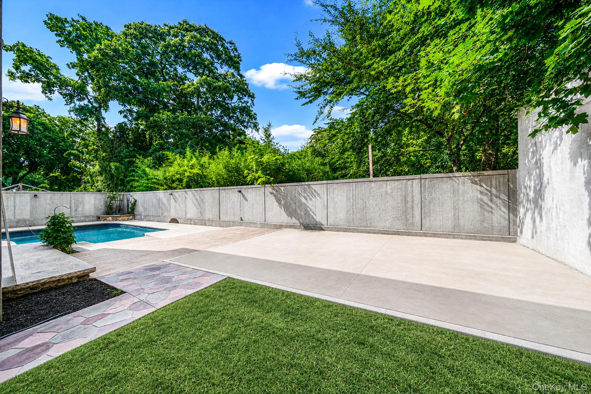 Backyard patio with basketball courtDigitally enhanced Backyard patio with basketball courtDigitally enhanced