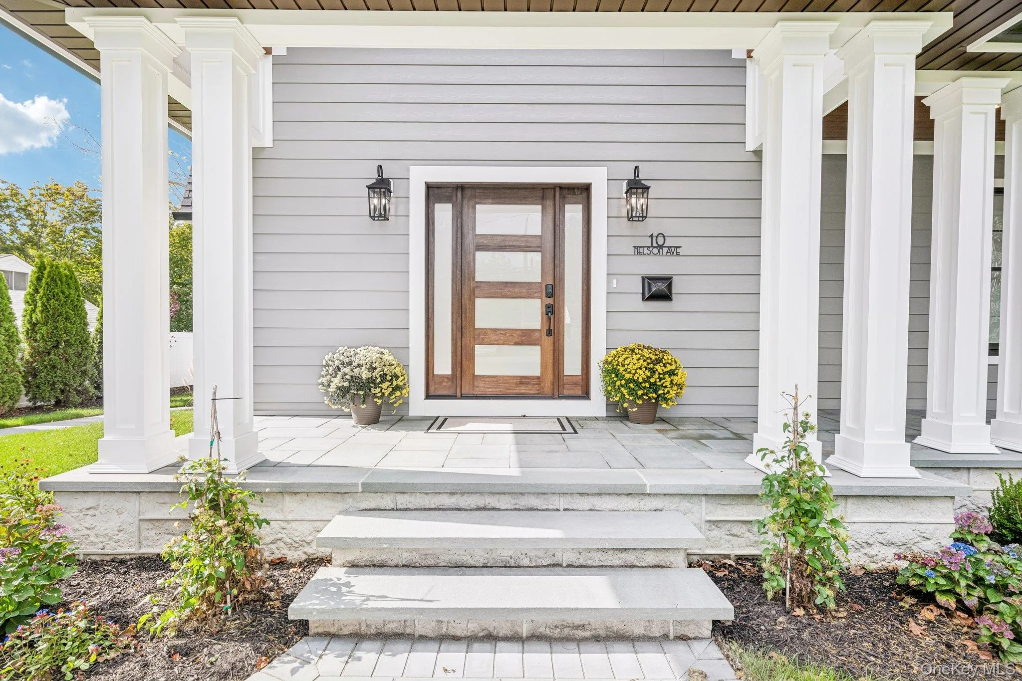 A columned front porch with stone steps, made for rocking chairs and hellos. Neighbors gather at Cavanaugh's on Blue Point Avenue, the local pub for nearly 40 years, minutes away. A columned front porch with stone steps, made for rocking chairs and hellos. Neighbors gather at Cavanaugh's on Blue Point Avenue, the local pub for nearly 40 years, minutes away.