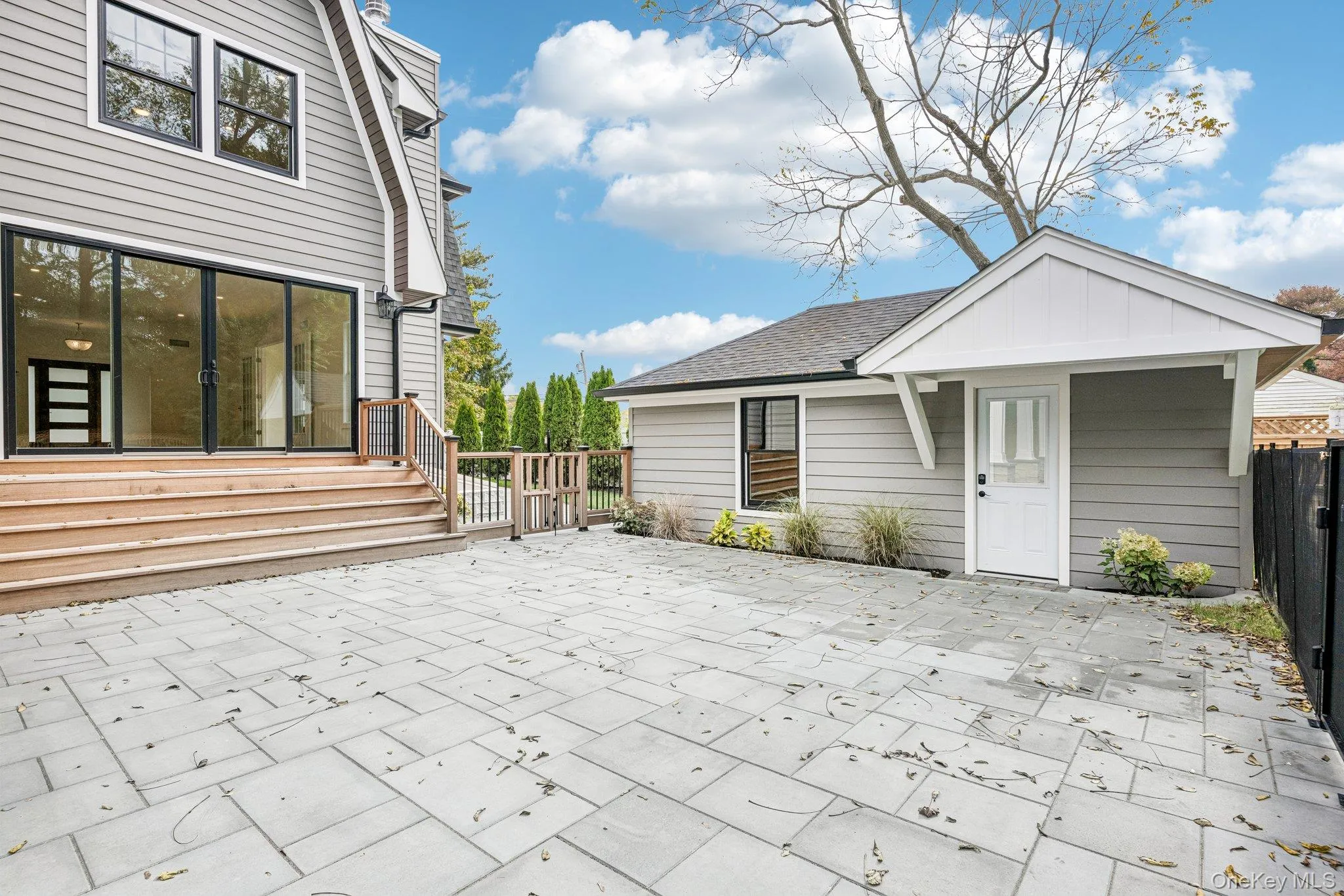 A paver patio and mahogany rear deck for evenings al fresco. Fill the planters from Bayport Flower Houses on Montauk Highway, a short drive west. A paver patio and mahogany rear deck for evenings al fresco. Fill the planters from Bayport Flower Houses on Montauk Highway, a short drive west.