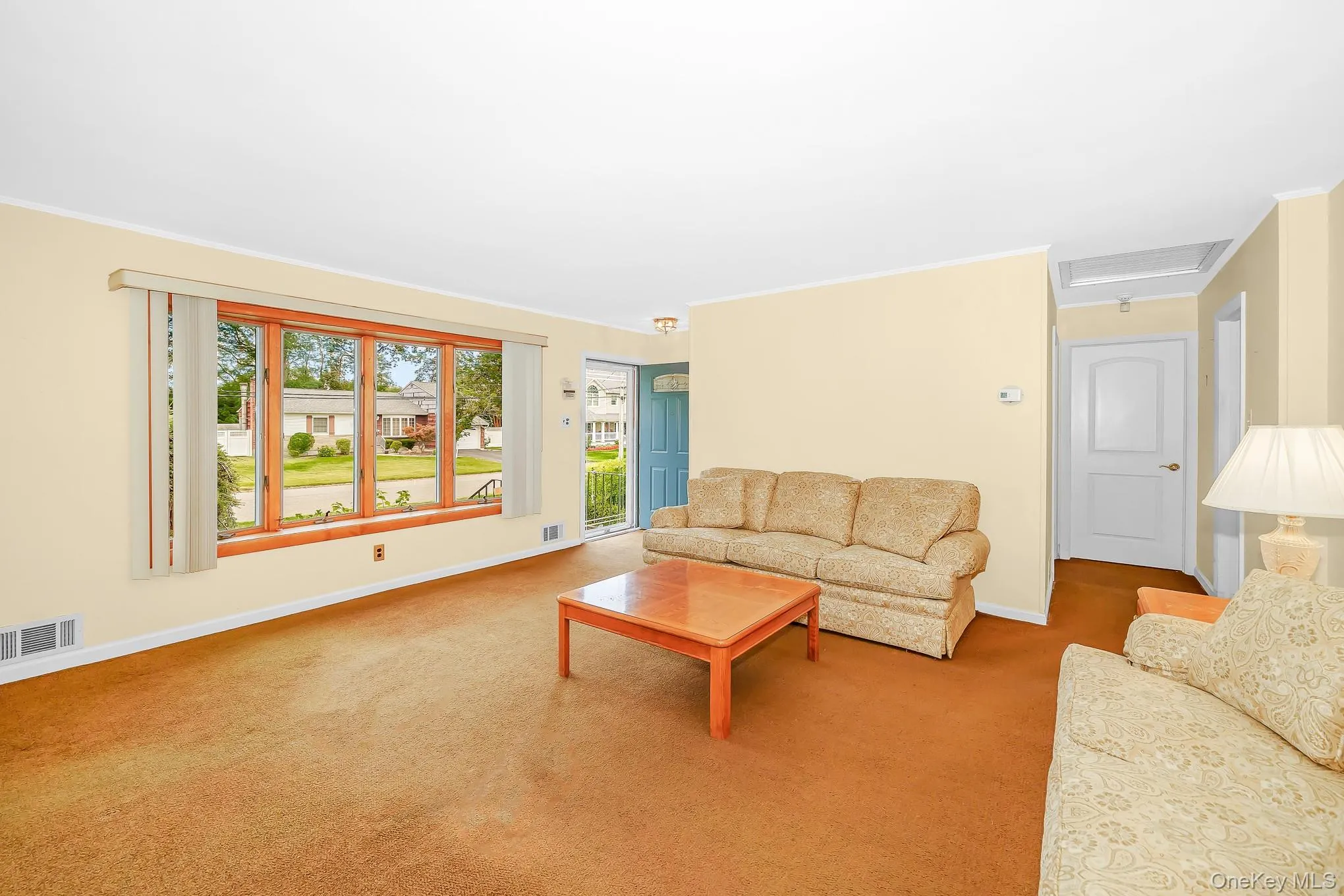 With large bay window and carpeting With large bay window and carpeting