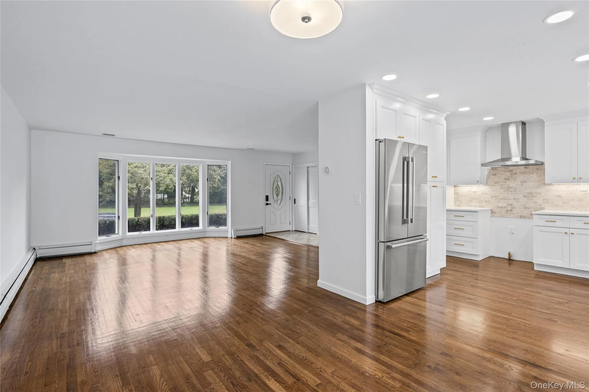 View from Dining Room into Living Room- Lovely open floor plan for living and entertaining. View from Dining Room into Living Room- Lovely open floor plan for living and entertaining.