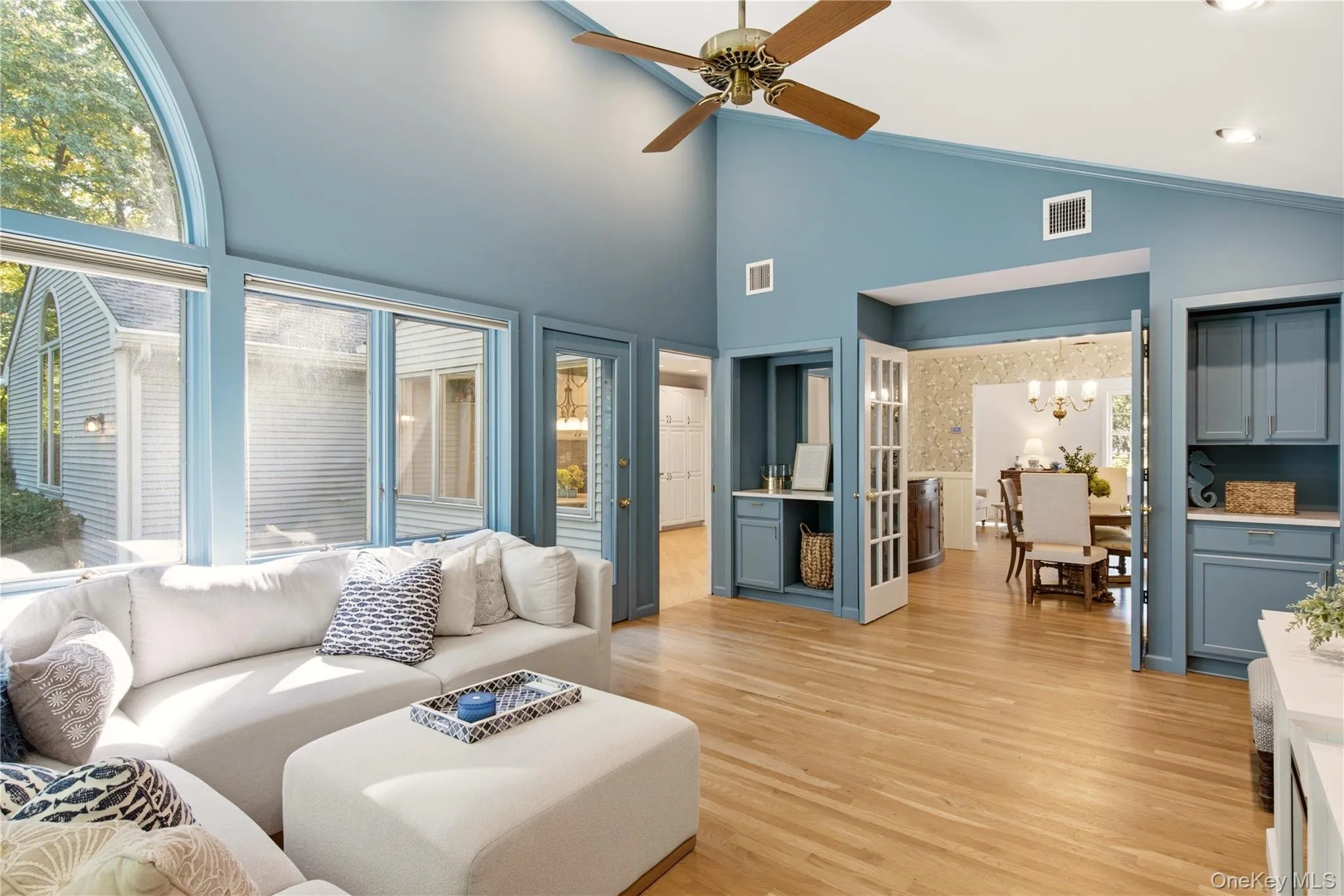 Vaulted ceilings, dry bar, built ins and door to deck in backyard Vaulted ceilings, dry bar, built ins and door to deck in backyard