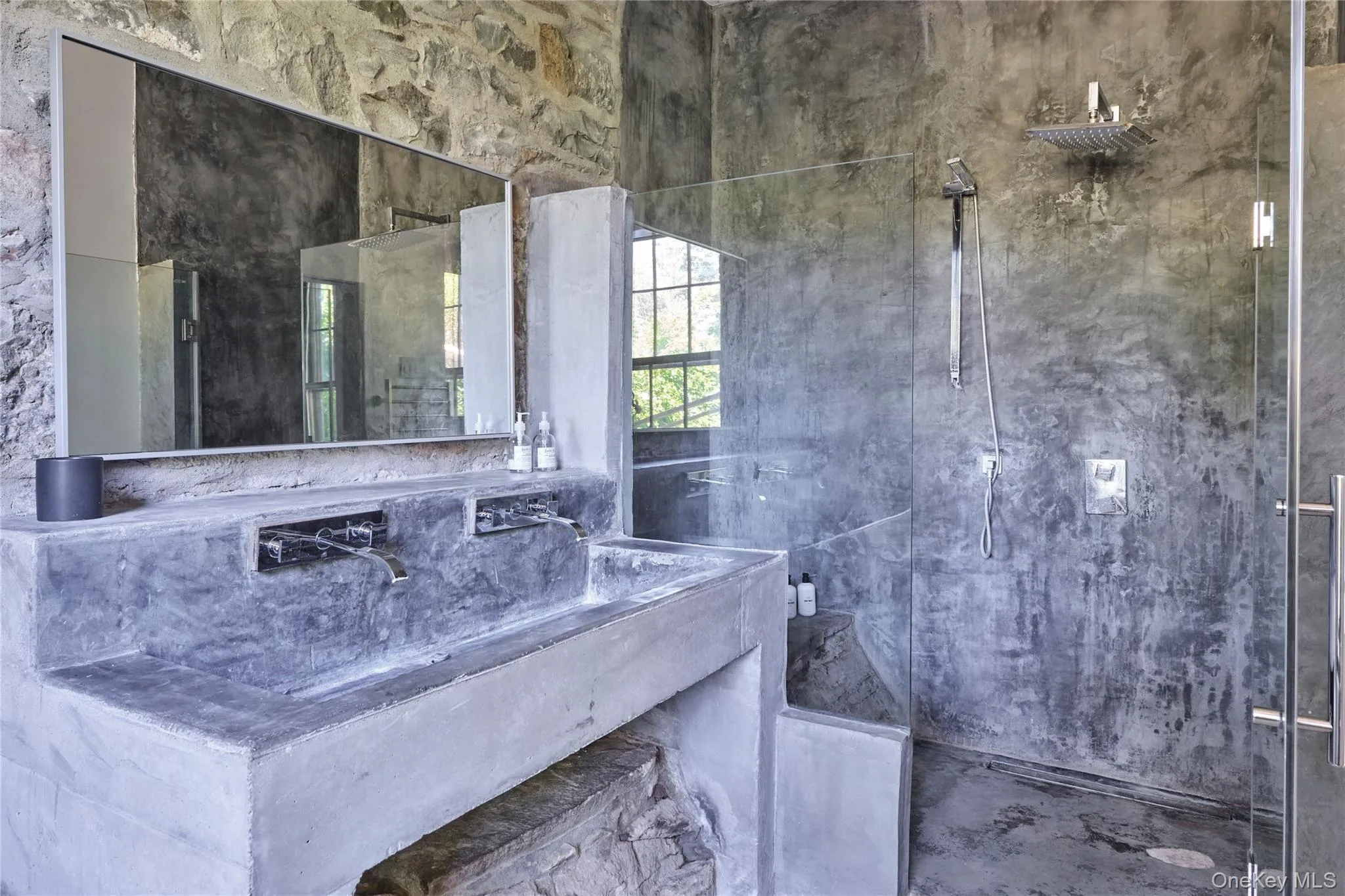 Full bath with vanity and a marble finish shower Full bath with vanity and a marble finish shower