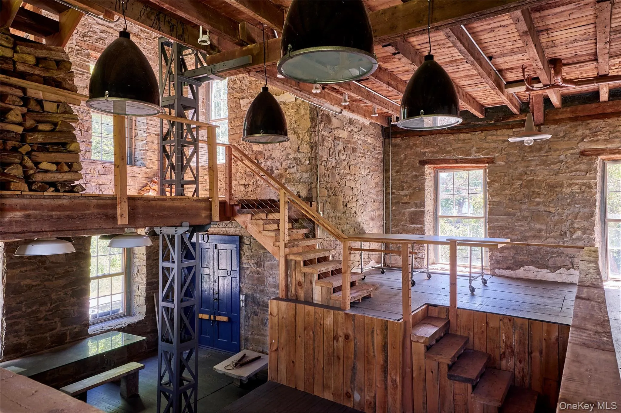 Stairs featuring a wood ceiling with exposed beams Stairs featuring a wood ceiling with exposed beams
