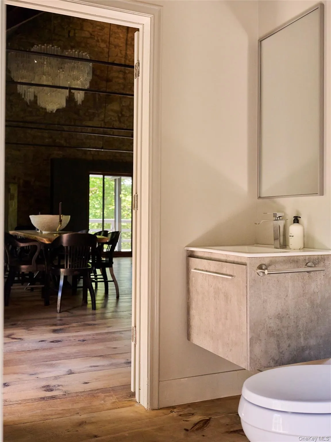 Bathroom featuring vanity and hardwood / wood-style flooring Bathroom featuring vanity and hardwood / wood-style flooring