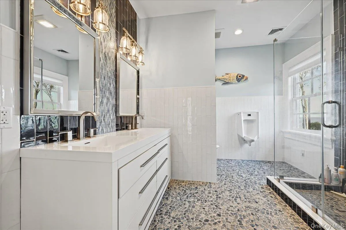 Dual vanity with integrated sinks and modern hardware Dual vanity with integrated sinks and modern hardware