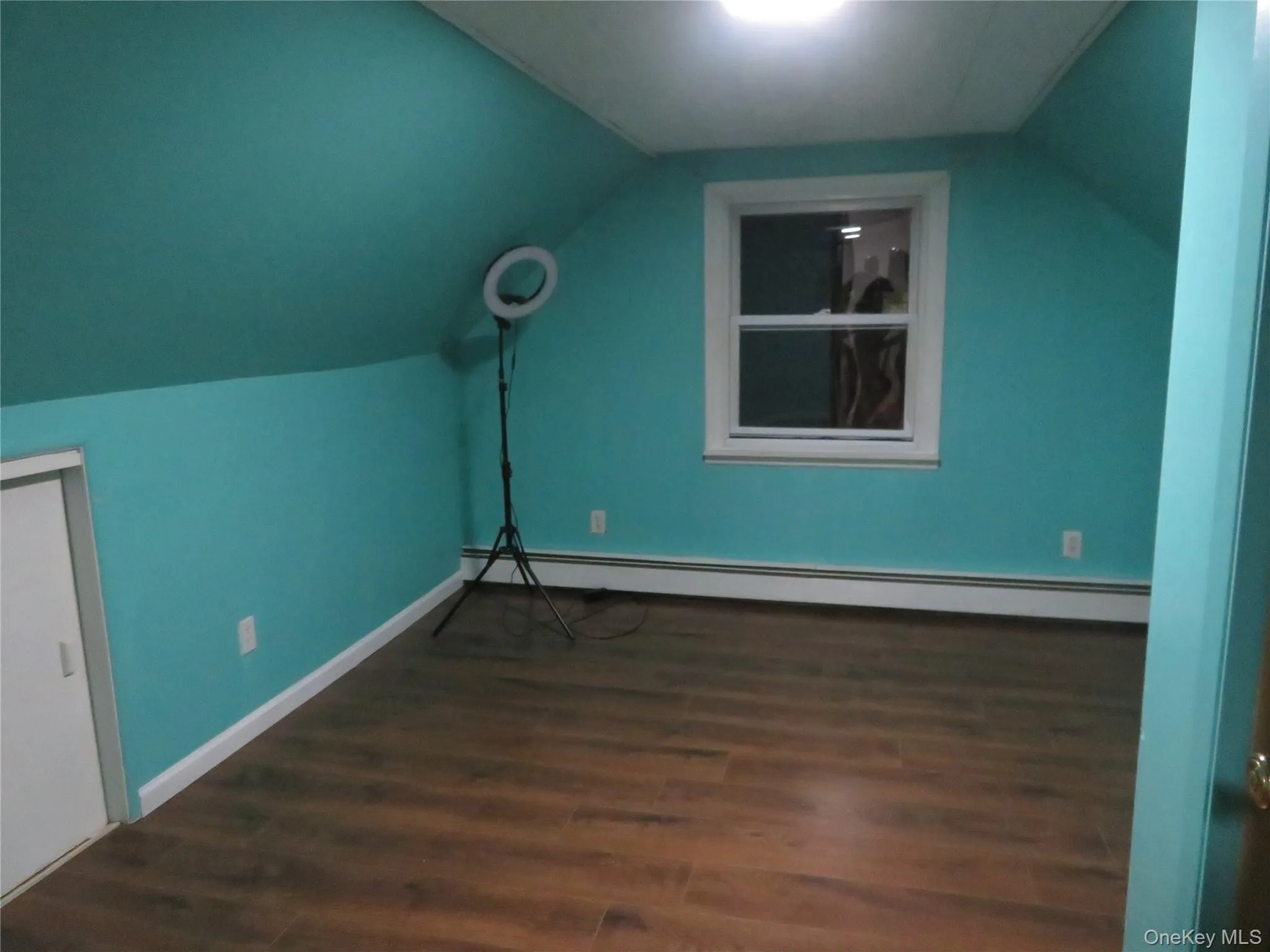 Blue Room. Vaulted ceiling, wood-finish flooring, and built-in under-eave storage cabinetry Blue Room. Vaulted ceiling, wood-finish flooring, and built-in under-eave storage cabinetry