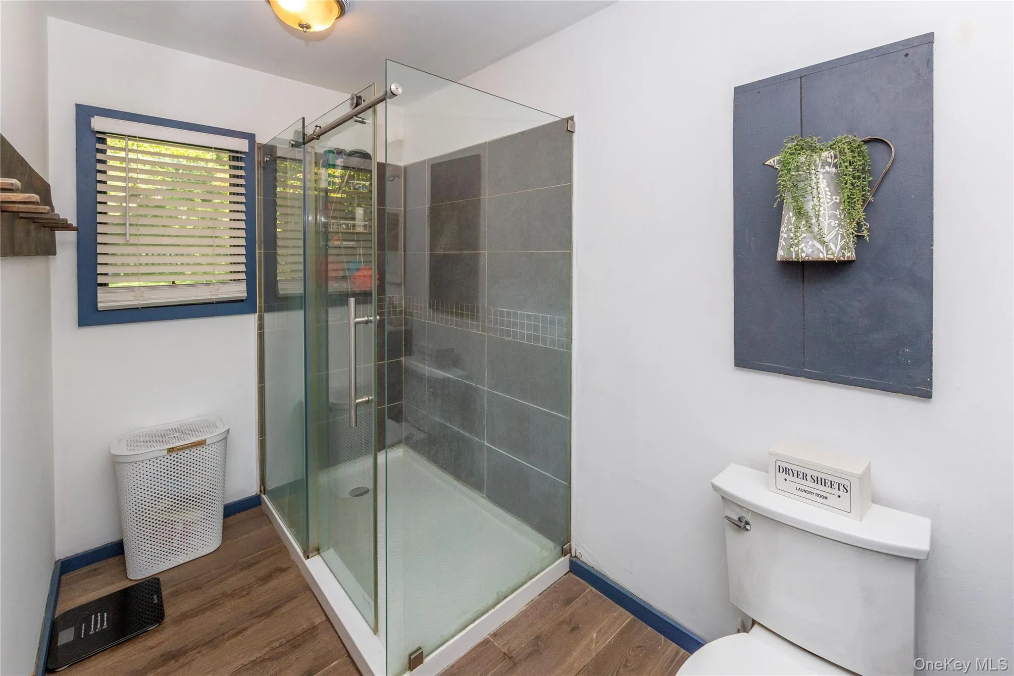 Large walk-in shower with sliding glass shower doors. Large walk-in shower with sliding glass shower doors.