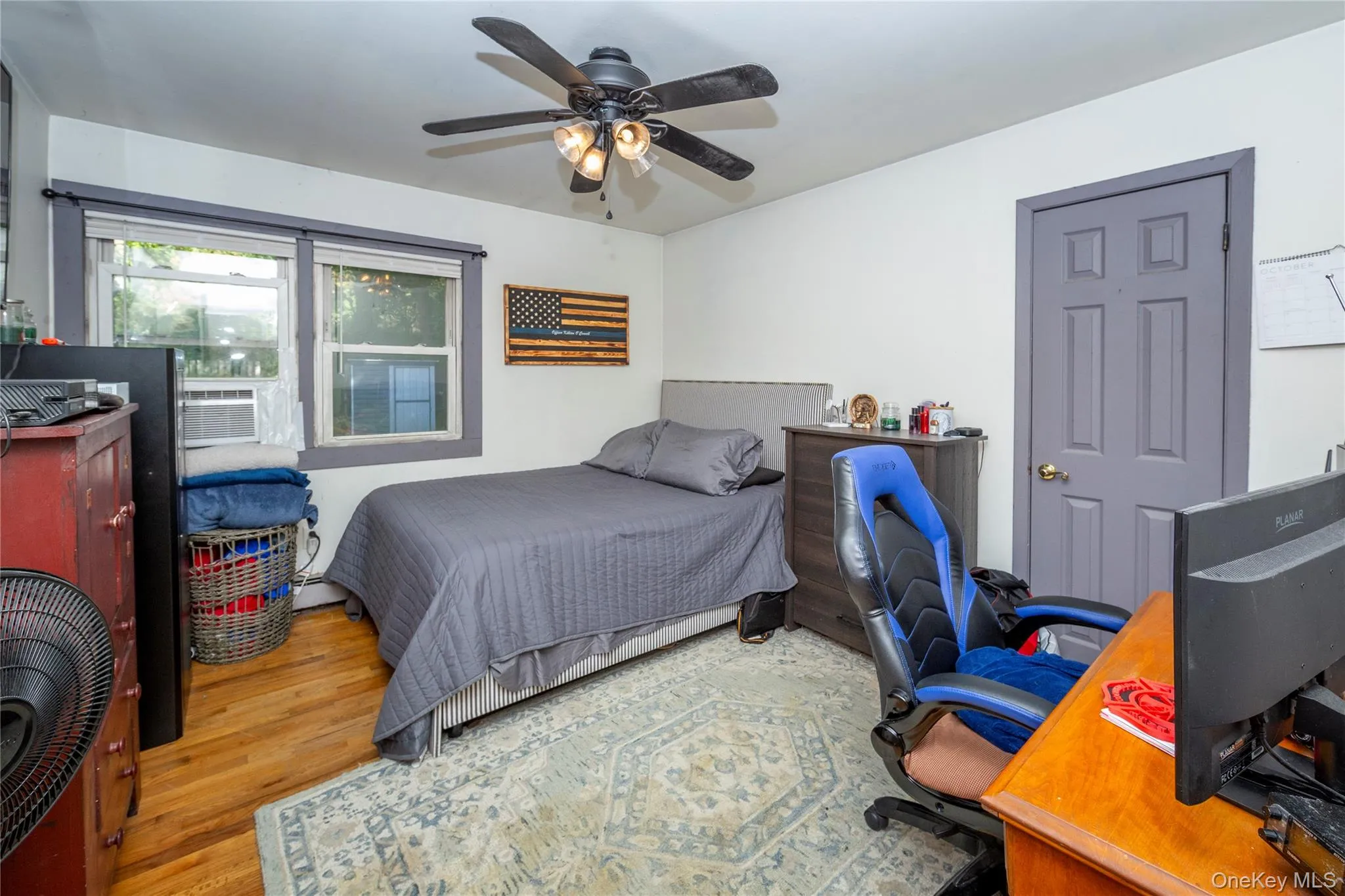 The main floor boasts five versatile bedrooms. The current setup utilizes three as dedicated bedrooms. View of one of the bedrooms. The main floor boasts five versatile bedrooms. The current setup utilizes three as dedicated bedrooms. View of one of the bedrooms.