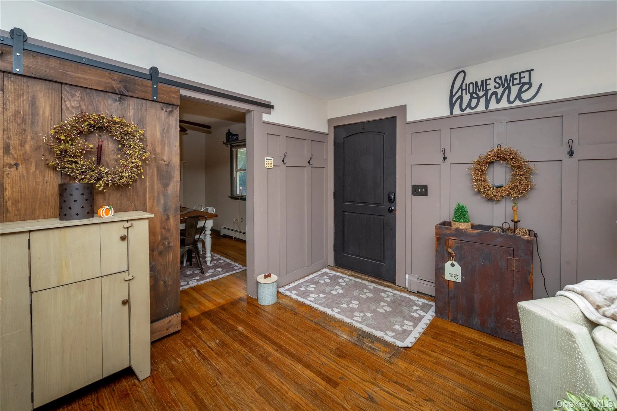Inside, the spacious living room greets you with hardwood floors. Inside, the spacious living room greets you with hardwood floors.