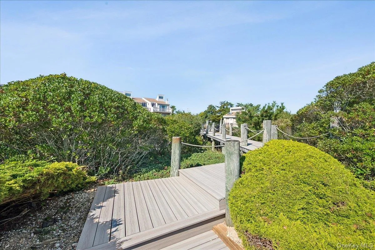 Pathway directly across from unit leading to the outdoor community pool. Pathway directly across from unit leading to the outdoor community pool.