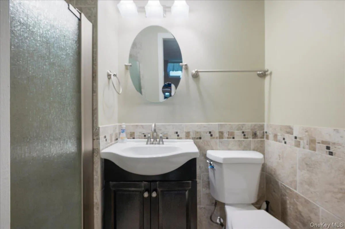 Third updated En Suite bathroom on main level. Third updated En Suite bathroom on main level.