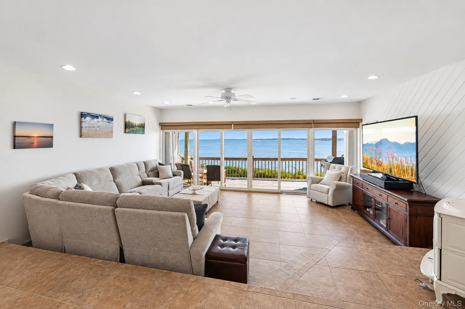 Formal Living with brand new floor to ceiling sliders leading to the Deck right on the Bay. Formal Living with brand new floor to ceiling sliders leading to the Deck right on the Bay.