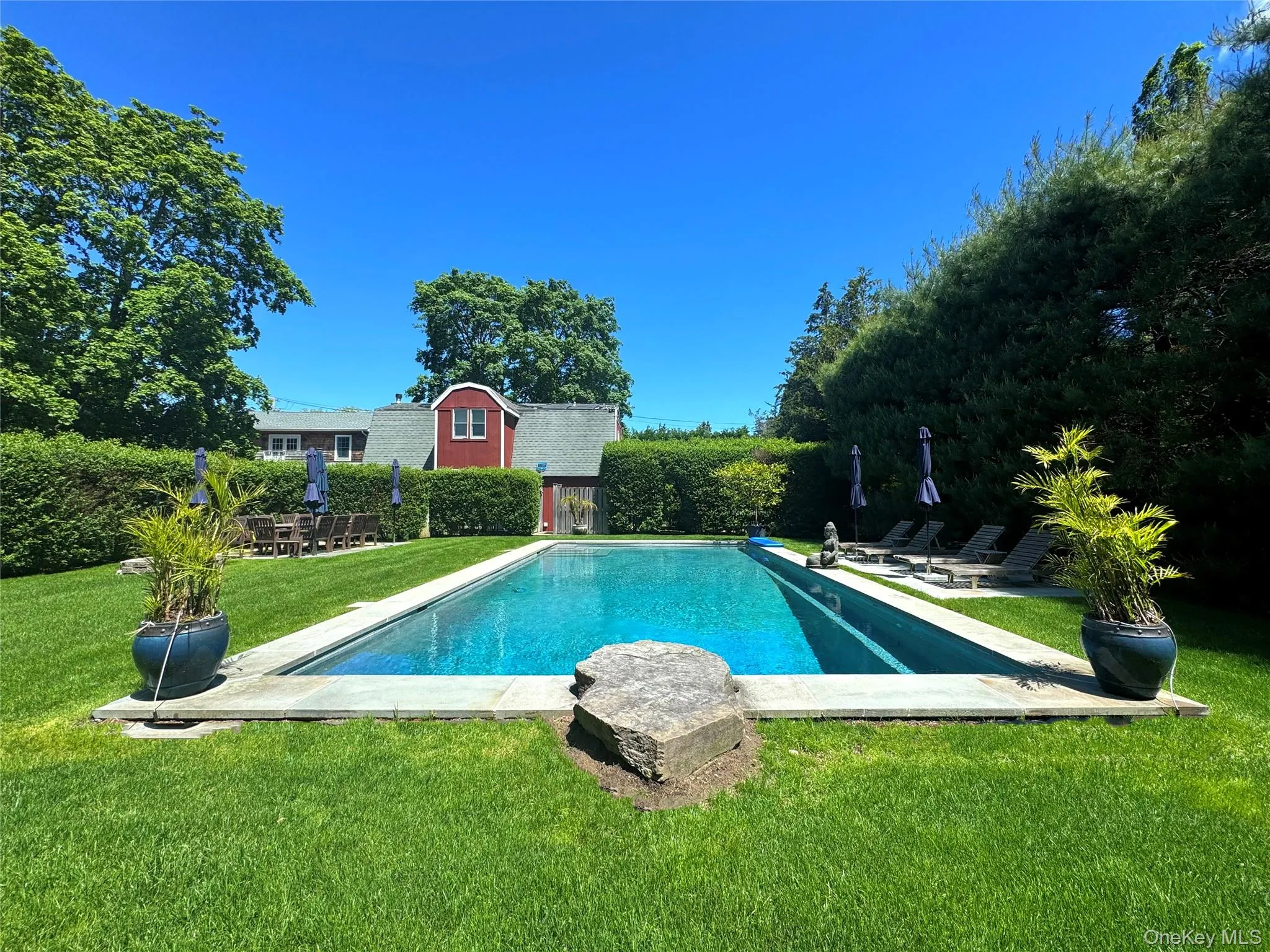 View of pool with a yard and a patio View of pool with a yard and a patio