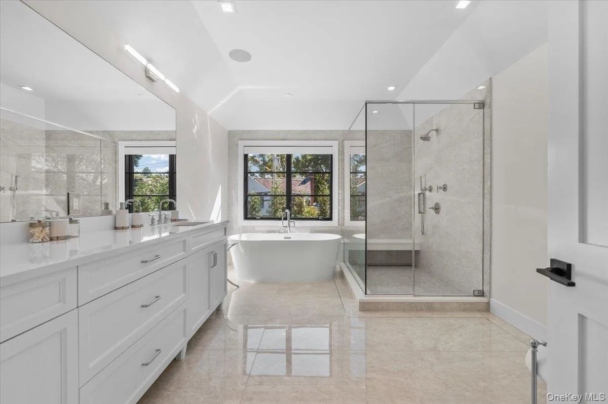 Luxurious primary bathroom with soaking tub, large, walk-in shower and double sink vanity. Luxurious primary bathroom with soaking tub, large, walk-in shower and double sink vanity.