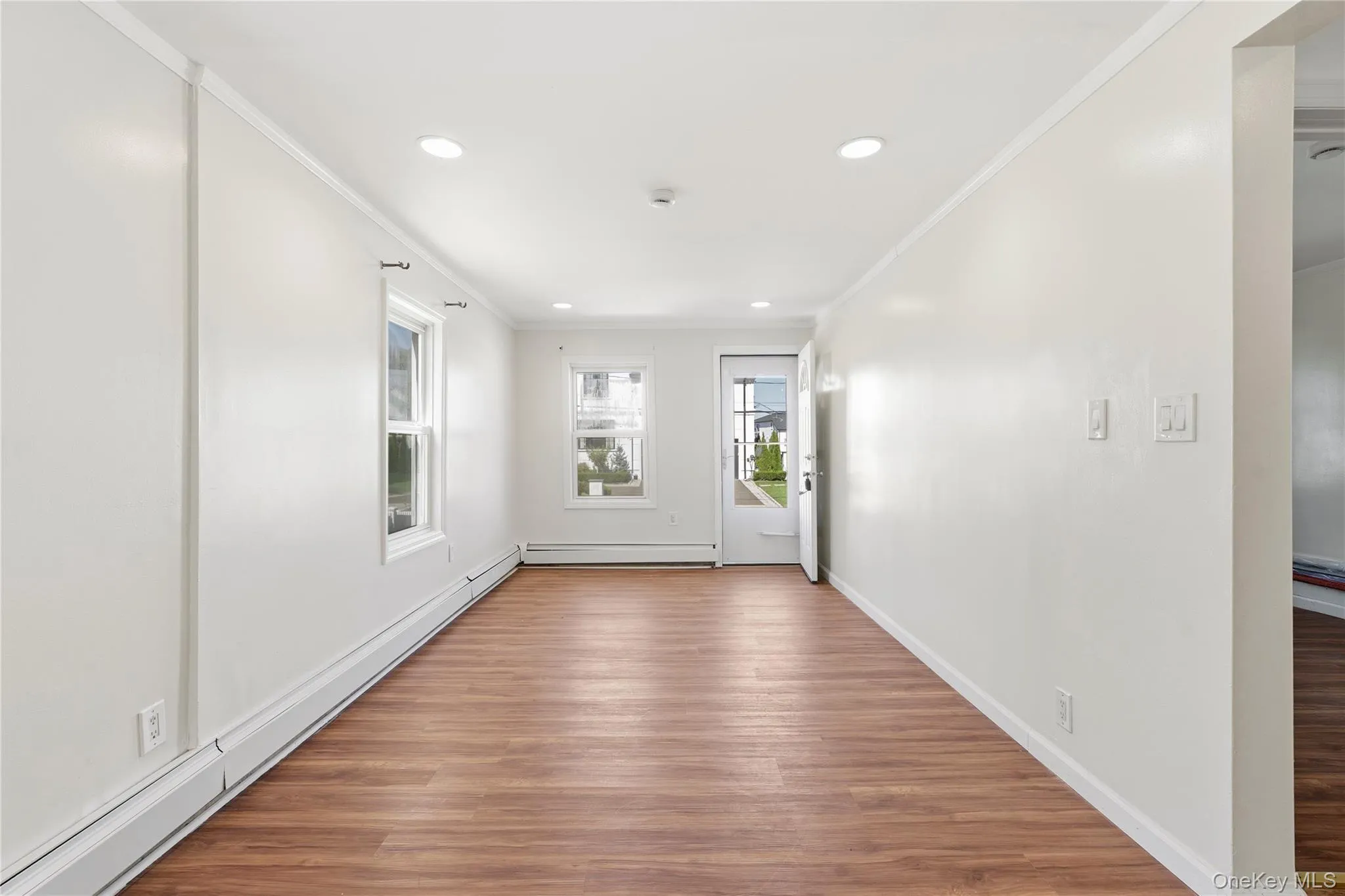 Enter into Main Level Living Room. Laminate flooring, hi-hat lighting, and fresh paint throughout Enter into Main Level Living Room. Laminate flooring, hi-hat lighting, and fresh paint throughout
