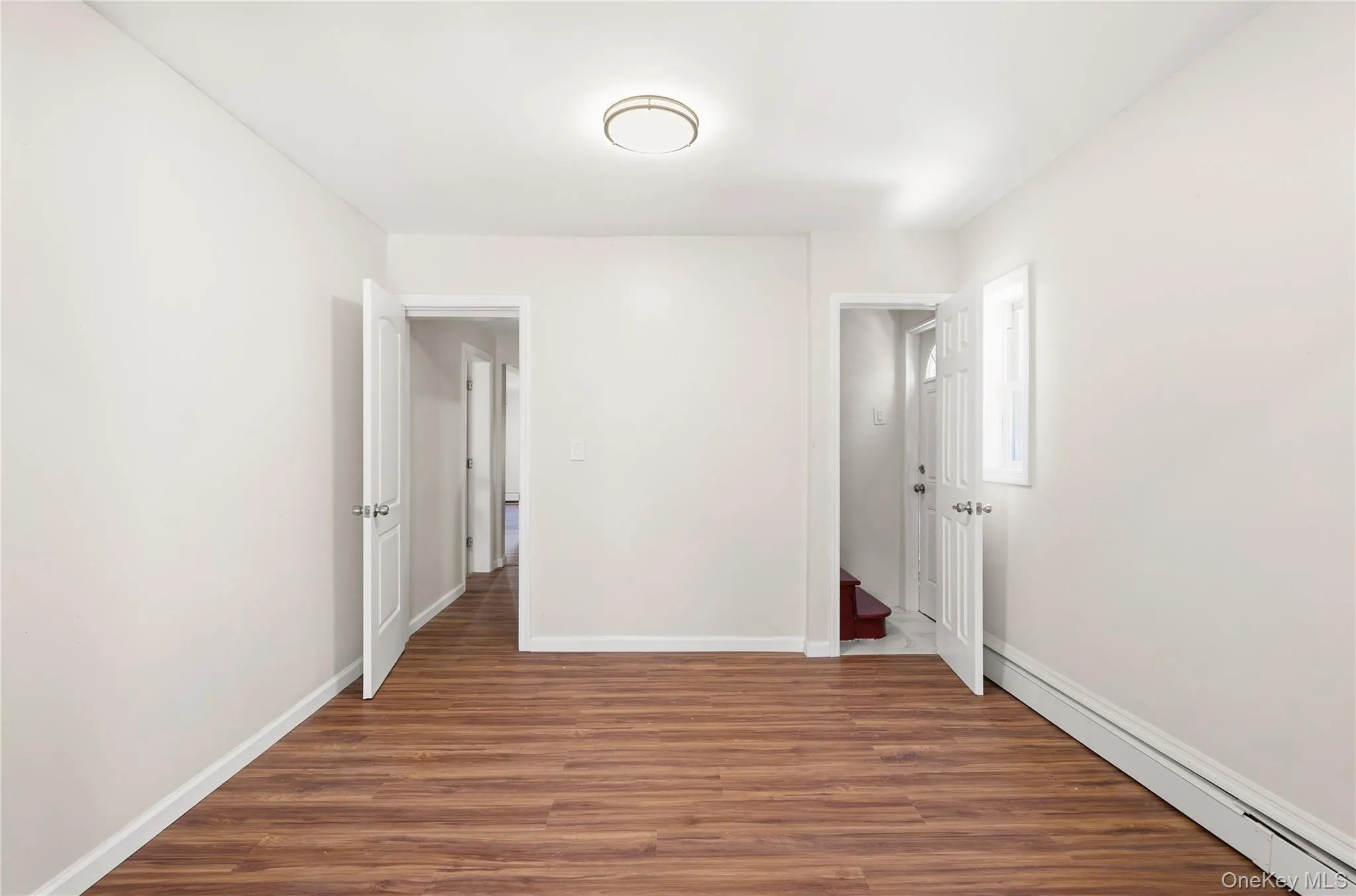 With door to upstairs and another to outside side entry With door to upstairs and another to outside side entry