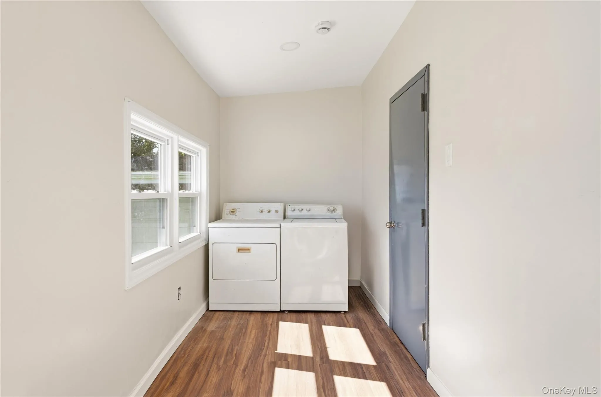 Main level laundry room and door to utility closet for gas burner Main level laundry room and door to utility closet for gas burner