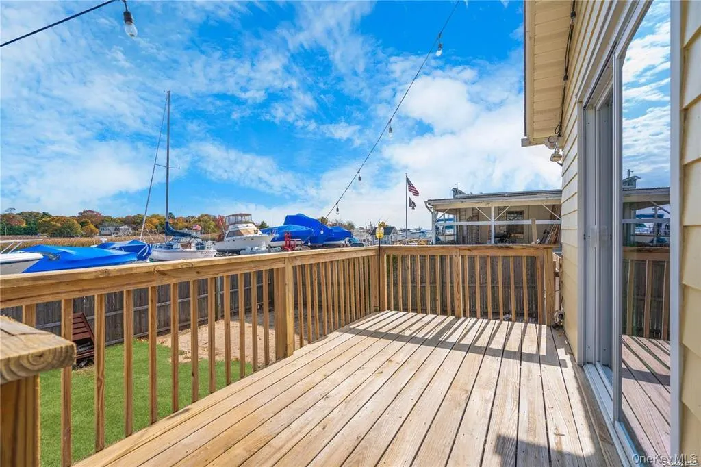 Wooden deck with a water view off the family room Wooden deck with a water view off the family room
