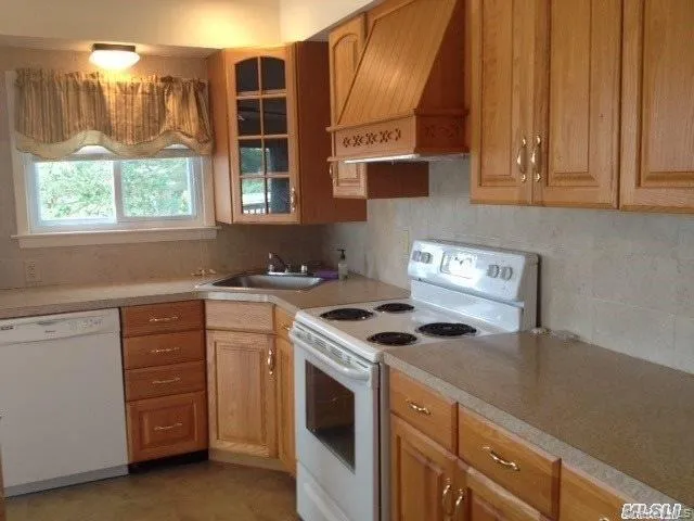 Generous workspace includes a dishwasher and pantry Generous workspace includes a dishwasher and pantry