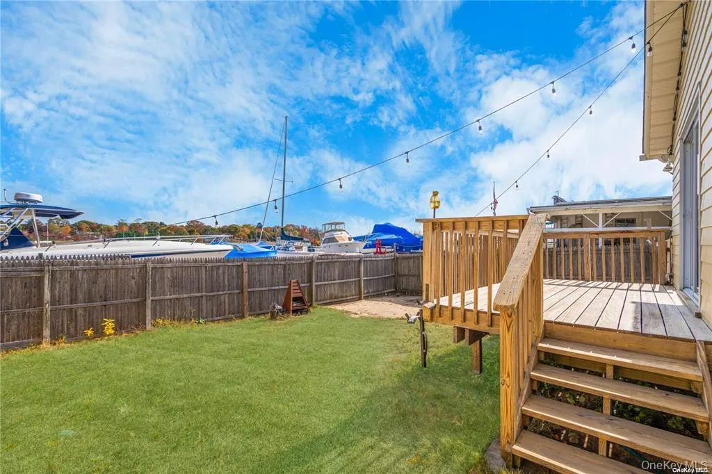 Fenced in backyard featuring a deck Fenced in backyard featuring a deck