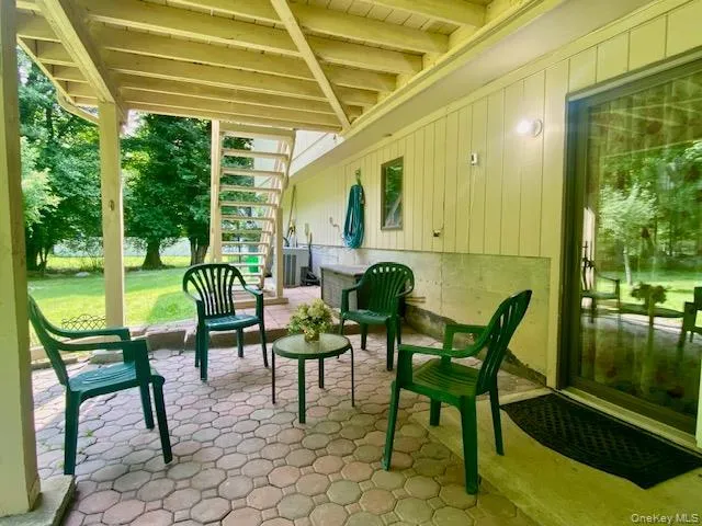Sunroom / solarium featuring beam ceiling Sunroom / solarium featuring beam ceiling