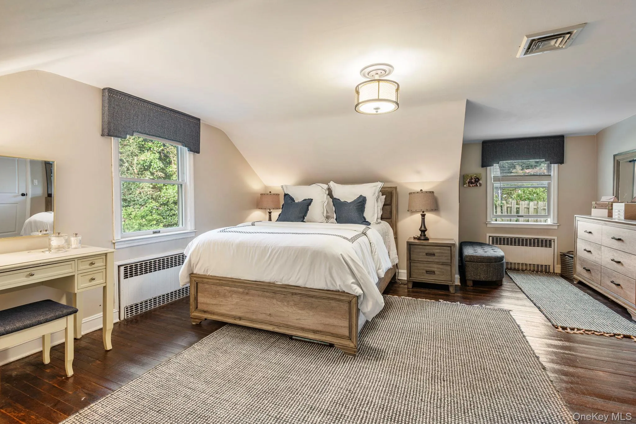Large primary bedroom with extra space. Large primary bedroom with extra space.