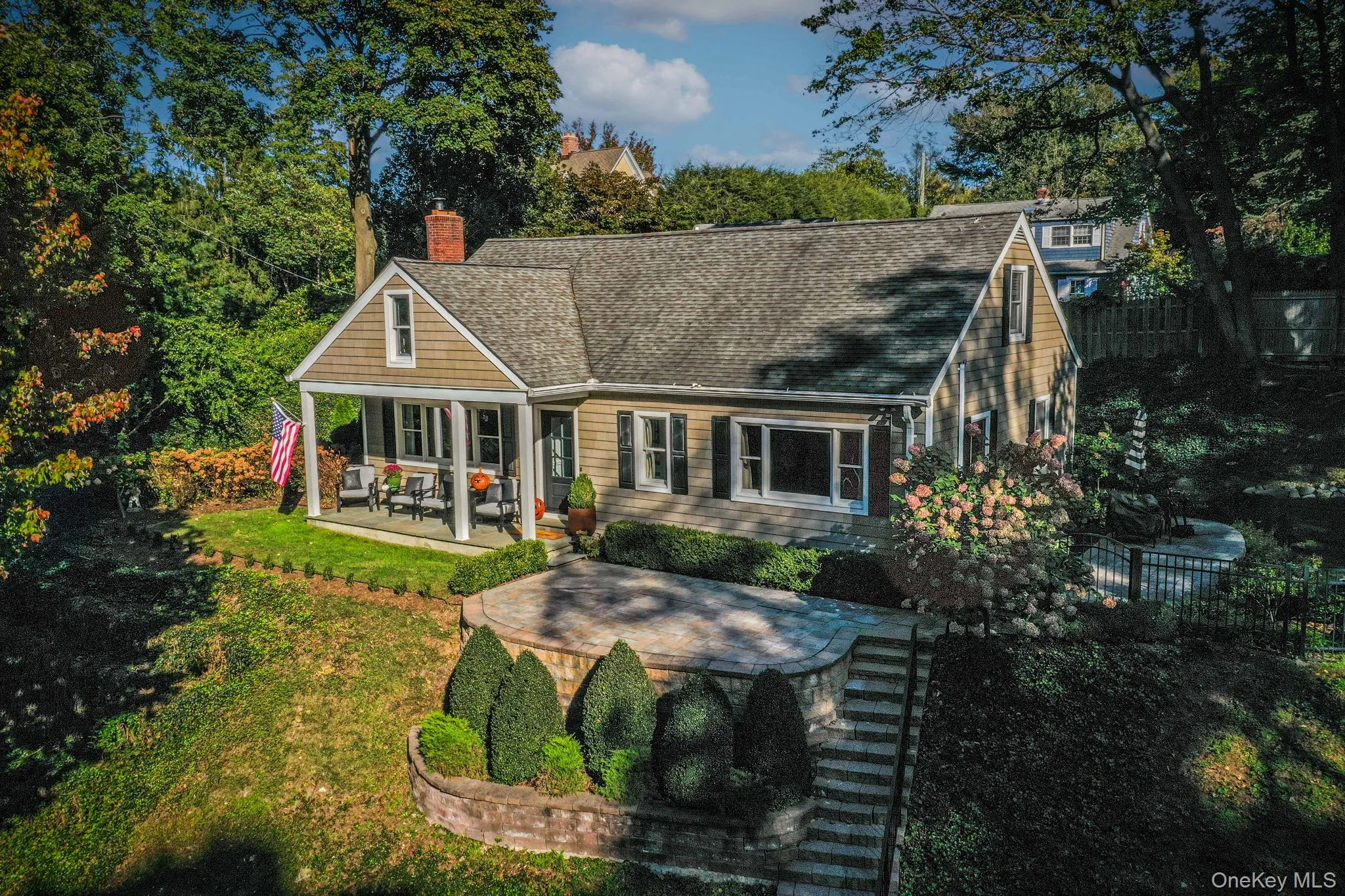 Beautiful cape with porch area and patios. Beautiful cape with porch area and patios.