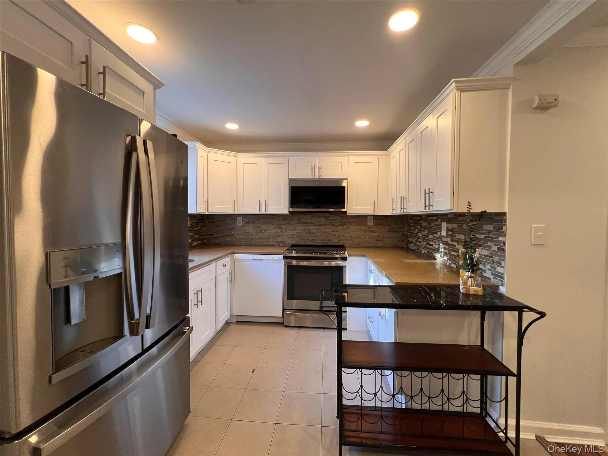 White shaker cabinets, stainless steel appliances White shaker cabinets, stainless steel appliances