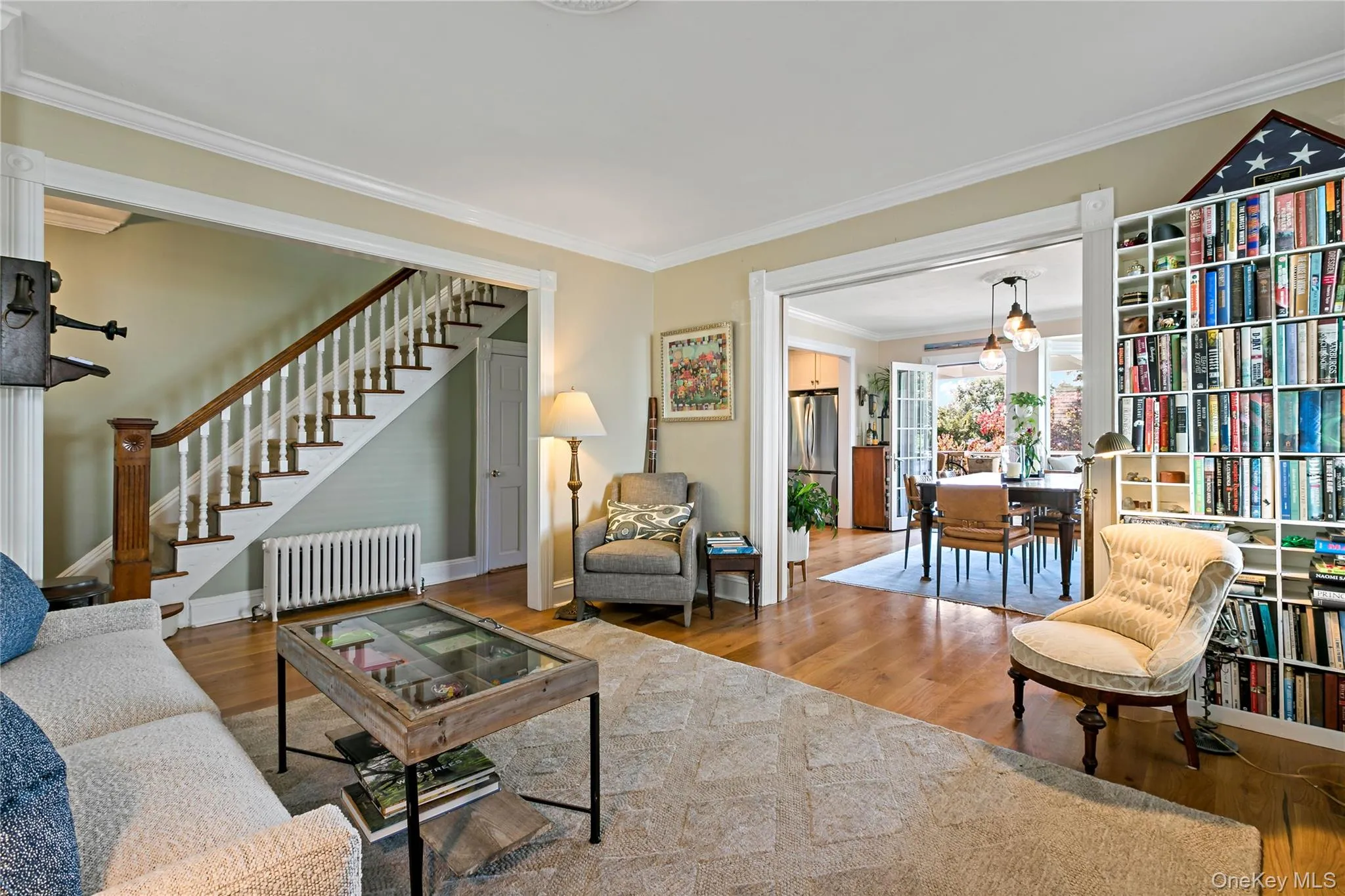 Another angle of living room showing enormous glass pocket doors open to formal dining room. Another angle of living room showing enormous glass pocket doors open to formal dining room.