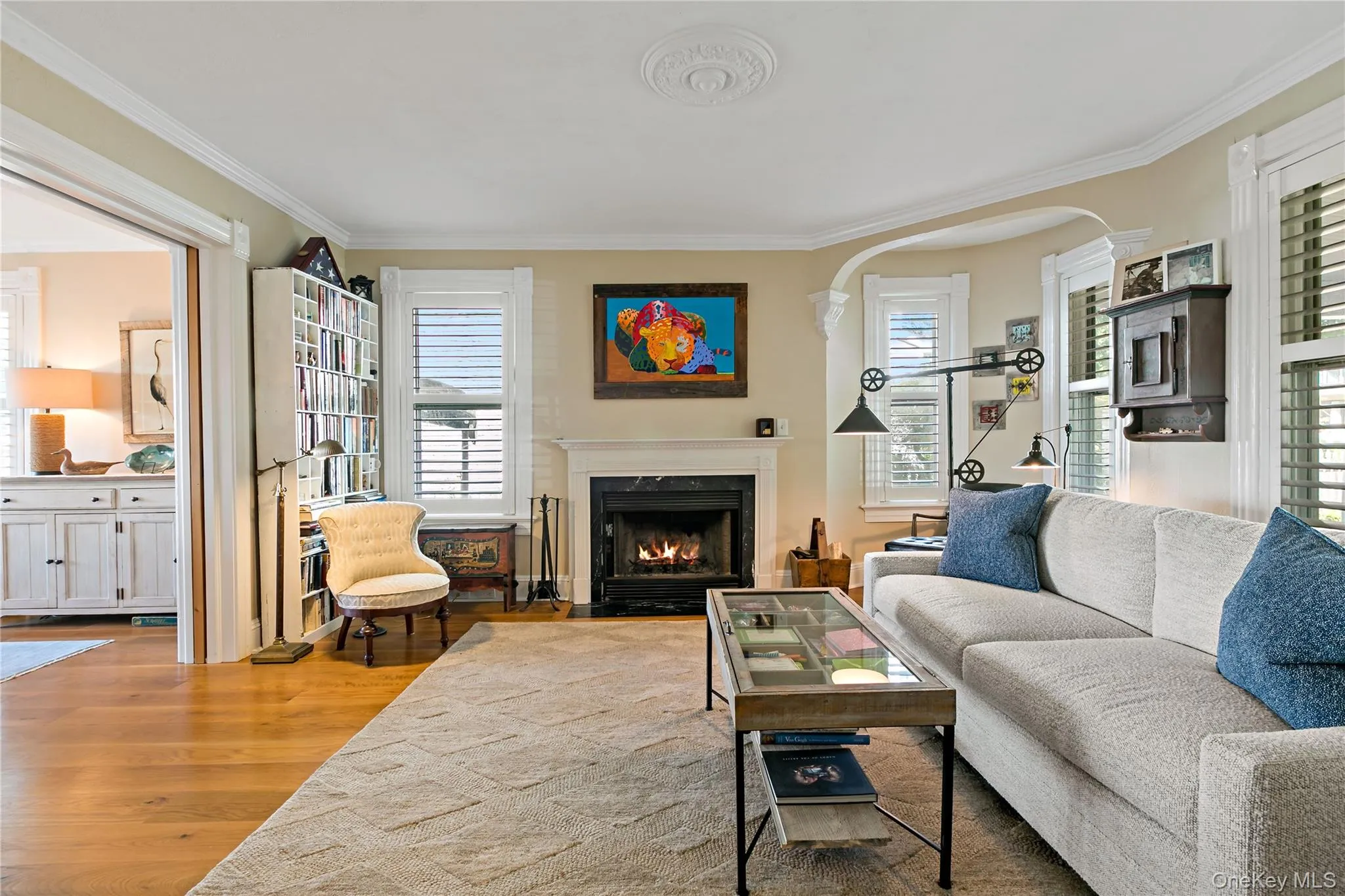 Formal living room with wood burning fireplace. Formal living room with wood burning fireplace.