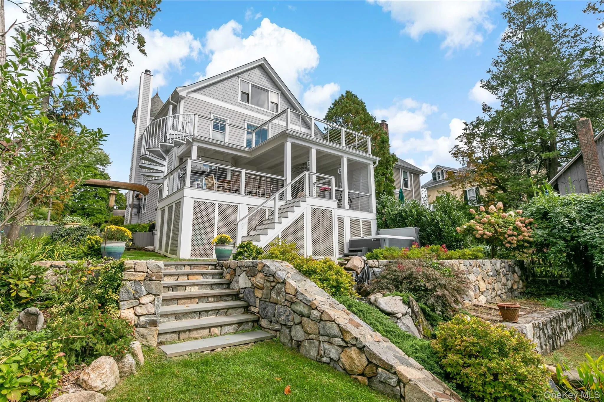 Luxury living with koi pond, hot tub and two tier decking. Please note whimsical canoe archway entrance. Luxury living with koi pond, hot tub and two tier decking. Please note whimsical canoe archway entrance.