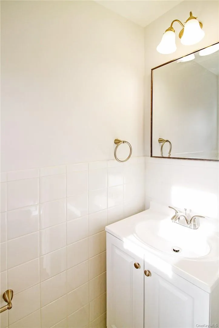 Formal powder room in front hall. Photos taken when house was empty prior to occupancy. Formal powder room in front hall. Photos taken when house was empty prior to occupancy.