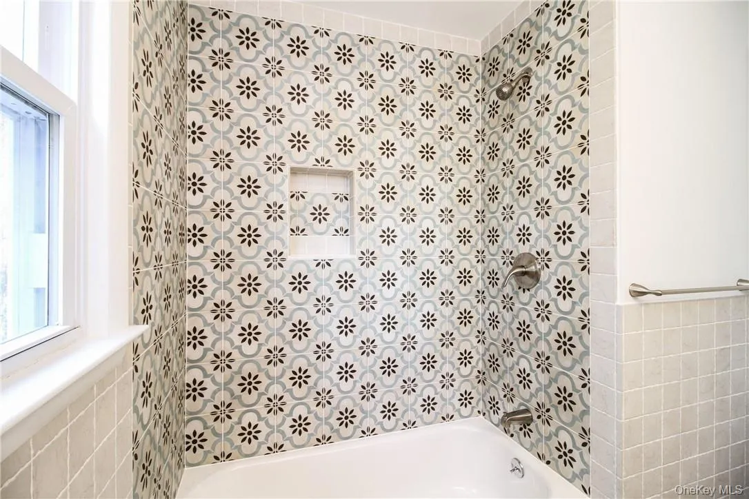 Detail of tub/shower area in hall bath. Photos taken when house was empty prior to occupancy. Detail of tub/shower area in hall bath. Photos taken when house was empty prior to occupancy.