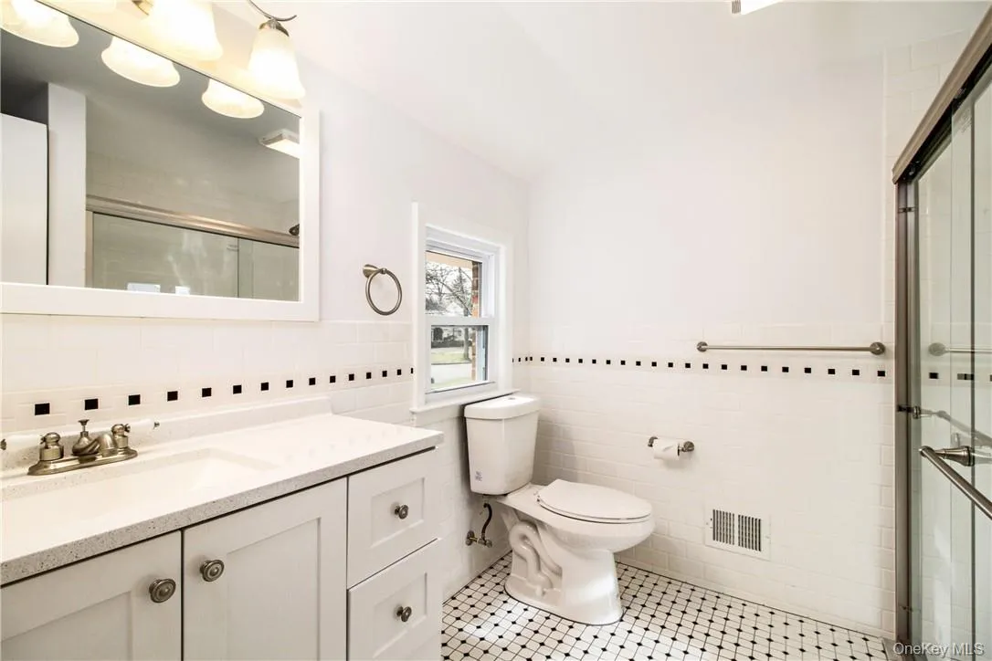 Principal suite bath with large shower. Photos taken when house was empty prior to occupancy. Principal suite bath with large shower. Photos taken when house was empty prior to occupancy.